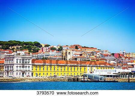 Stock Image - Commerce Square, Se Cathedral, Casa dos Bicos view of a boat, Pembaline, Lisbon, Portugal.. Fotosearch