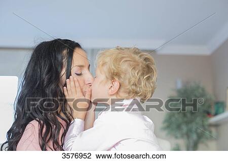 Cute little boy kissing mum View Large Photo Image Stock Image - Cute little boy kissing mum. Fotosearch