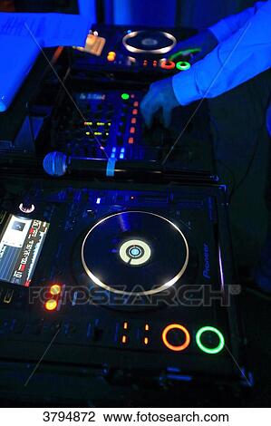Dj handling the turntables. View Large Photo Image Stock Image - Dj handling the turntables.. Fotosearch