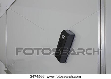 Stock Photograph - Eraser on the magnetic whiteboard in a multimedia classroom. Fotosearch