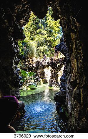 Stock Photo - Exit of a cave in the garden of Pena, Sintra, Lisbon area, Portugal. Fotosearch