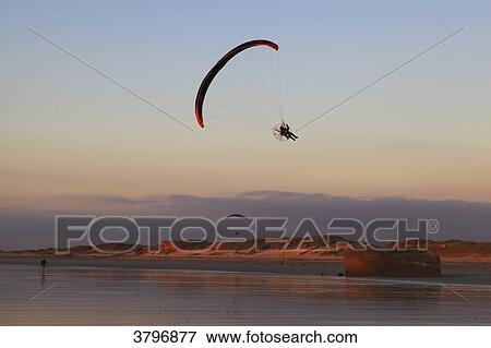 Stock Photo - France, Brittany, Finistere. Audierne bay. Parasailing.. Fotosearch