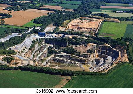Stock Image - France, Brittany, Morbihan. Aerial view of a quarry.. Fotosearch