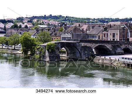 Picture - France, Center France, Burgundy, Pont-sur-Yonne, along the Yonne River, church bell and rooftop of the church, destroyed bridge. Fotosearch