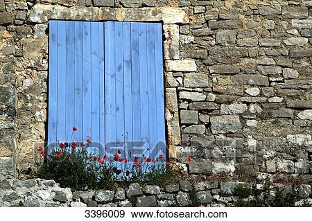 France, Closed blue shutters of a stone house, poppies View Large Photo Image Stock Photo - France, Closed blue shutters of a stone house, poppies. Fotosearch
