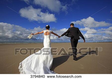 France, couple of married on the beach. View Large Photo Image Stock Image - France, couple of married on the beach.. Fotosearch