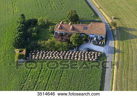 France, Dordogne, aerial view of a house in the middle of a field, surrounded by haystacks View Large Photo Image Stock Photograph - France, Dordogne, aerial view of a house in the middle of a field, surrounded by haystacks. Fotosearch