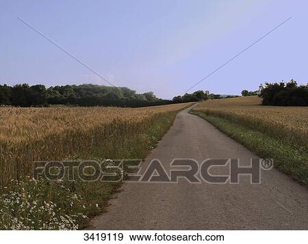 Stock Photo - France, Eastern France, Jura, road to the Granges Bernard (bed and breakfast). Fotosearch
