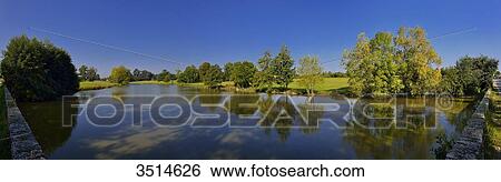 France, Europe, the city of Aigrefeuille-sur-Maine pond. Morning light, blue sky View Large Photo Image Stock Photograph - France, Europe, the city of Aigrefeuille-sur-Maine pond. Morning light, blue sky. Fotosearch