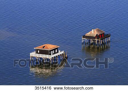 France, Gironde. Arcachon Bay. Bird Island. Cabin built on stilts. View Large Photo Image Stock Photograph - France, Gironde. Arcachon Bay. Bird Island. Cabin built on stilts.. Fotosearch