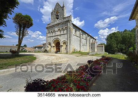 France, Gironde, Church of Tauriac, under a blue sky. Flowerbed in the foreground View Large Photo Image Stock Photography - France, Gironde, Church of Tauriac, under a blue sky. Flowerbed in the foreground. Fotosearch
