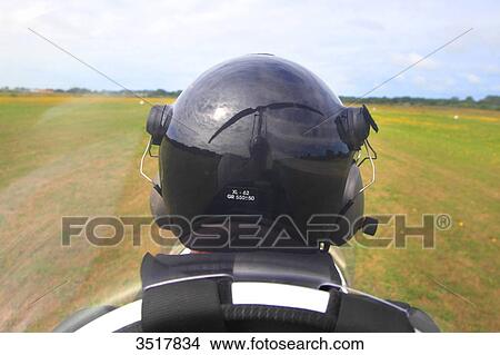 France, gyropter pilot. Blades reflecting on the helmet. View Large Photo Image Picture - France, gyropter pilot. Blades reflecting on the helmet.. Fotosearch