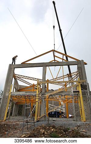 France, House building, handling safety with a crane, construction of a steel frame View Large Photo Image Stock Photograph - France, House building, handling safety with a crane, construction of a steel frame. Fotosearch