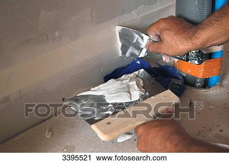 France, House building, plasterboard work, applying coating to strips and seals View Large Photo Image Stock Image - France, House building, plasterboard work, applying coating to strips and seals. Fotosearch