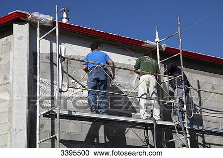 France, House building, safety on a scaffold/scale. masons making an exterior plaster on the facade View Large Photo Image Stock Image - France, House building, safety on a scaffold/scale. masons making an exterior plaster on the facade. Fotosearch