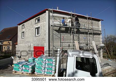 France, House building, safety on a scaffold/scale. masons making an exterior plaster on the facade View Large Photo Image Stock Image - France, House building, safety on a scaffold/scale. masons making an exterior plaster on the facade. Fotosearch