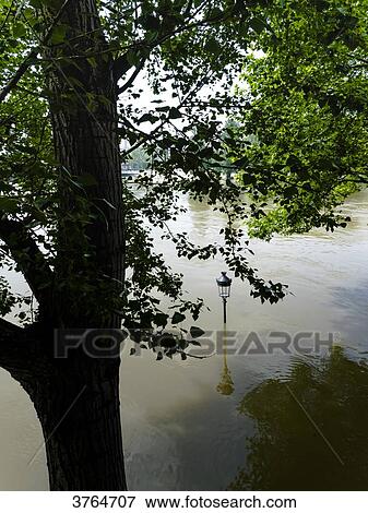 Stock Photo - France, Ile de France, Paris, the Seine overflowing and flooding, June 2016, the tip of the Ile St Louis. Fotosearch