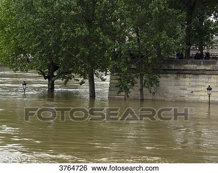 Stock Photograph - France, Ile de France, Paris, the Seine overflowing and flooding, June 2016, the 'Louis Aragon' square on the Ile St Louis. Fotosearch
