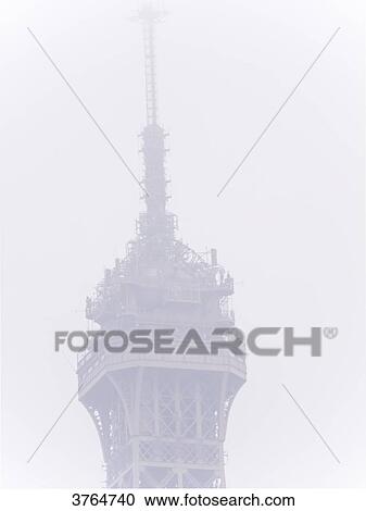 Stock Image - France, Ile de France, Paris, VIIth district, the Eiffel tower in the rain. Fotosearch