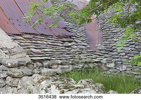 France, Lozere, old stone wall and stone tiles roof View Large Photo Image Stock Photo - France, Lozere, old stone wall and stone tiles roof. Fotosearch
