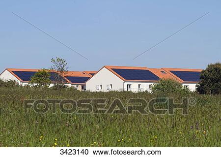 France, North-Eastern France, Brittany, Les Moutiers-en-Retz, solar panels on the roofops of collective dwellings View Large Photo Image Stock Image - France, North-Eastern France, Brittany, Les Moutiers-en-Retz, solar panels on the roofops of collective dwellings. Fotosearch