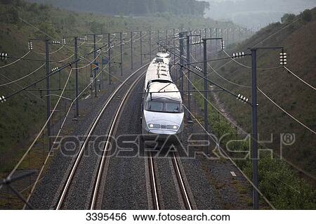 France, North-Eastern France, front view of a TGV East high-speed train from a bridge in a curve. Landscape View Large Photo Image Stock Photograph - France, North-Eastern France, front view of a TGV East high-speed train from a bridge in a curve. Landscape. Fotosearch