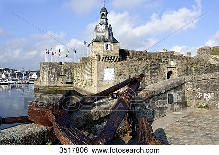 Stock Photograph - France, North-Western France, Brittany, Concarneau, former battlements protecting the walled town, ship's anchor. Fotosearch