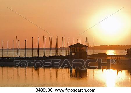 France, North-Western France, La Bernerie-en-Retz, sunset on the artificial water damming View Large Photo Image Stock Image - France, North-Western France, La Bernerie-en-Retz, sunset on the artificial water damming. Fotosearch