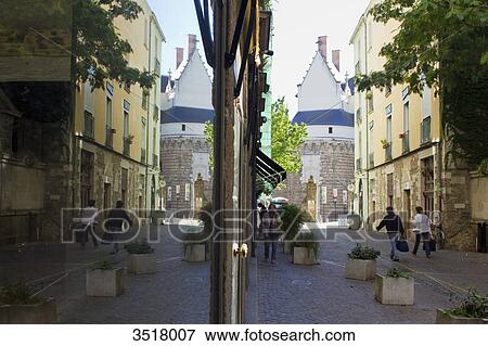 Stock Photo - France, North-Western France, Nantes, Rue du Chateau, reflections in shop window. Fotosearch