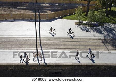 France, North-Western France, Nantes, John Kennedy courtyard, pedestrians and cyclists shapes View Large Photo Image Stock Photo - France, North-Western France, Nantes, John Kennedy courtyard, pedestrians and cyclists shapes. Fotosearch