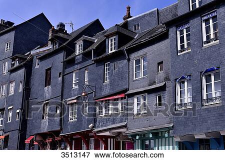 Stock Photo - France, Northern France, Lower Normandy, Honfleur, along the fishing harbour le Vieux Bassin. Historical houses classified as Historical Monuments. Fotosearch