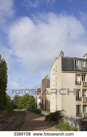 France, Paris, 15th district, small section of the Chemin de fer de Petite Ceinture (little belt railway) between the rue Saint Charles and the rue Olivier de Serres View Large Photo Image Stock Photo - France, Paris, 15th district, small section of the Chemin de fer de Petite Ceinture (little belt railway) between the rue Saint Charles and the rue Olivier de Serres. Fotosearch