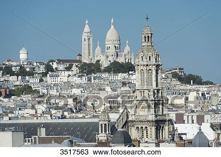 France. Paris 9th district. Bell tower of the Sainte Trinit church and the Sacre-Cur Basilica View Large Photo Image Stock Image - France. Paris 9th district. Bell tower of the Sainte Trinit church and the Sacre-Cur Basilica. Fotosearch