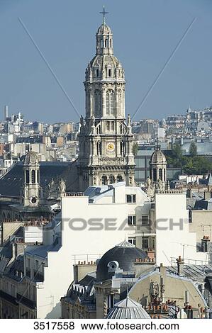Stock Photo - France. Paris 9th district. Bell tower of the Sainte Trinit church.. Fotosearch