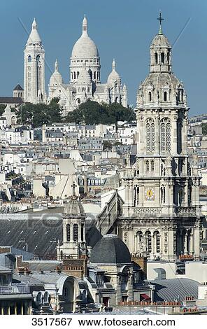 France. Paris 9th district. Bell tower of the Sainte Trinit church and the Sacre-Cur Basilica View Large Photo Image Stock Photo - France. Paris 9th district. Bell tower of the Sainte Trinit church and the Sacre-Cur Basilica. Fotosearch