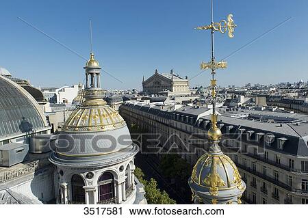 France. Paris 9th district. Turret of the department store Au Printemps. Far off: the Garnier Opera View Large Photo Image Stock Image - France. Paris 9th district. Turret of the department store Au Printemps. Far off: the Garnier Opera. Fotosearch