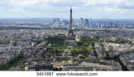 Stock Photo - France, Paris, aerial and panoramic view of Paris, Eiffel Tower in front of the towers of La Dfense.. Fotosearch