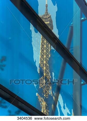 Stock Photograph - France, Paris, Eiffel Tower from the colored glass wall of the Quai Branly Museum. Fotosearch