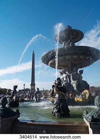Picture - France, Paris, Fountain of River on the Place de la Concorde with the Luxor Obelisk and the French Chamber of Deputies. Fotosearch