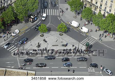 France, Paris, Place du 18 juin 1940 at the foot of the Montparnasse Tower. Many two-wheelers. Car traffic View Large Photo Image Stock Photo - France, Paris, Place du 18 juin 1940 at the foot of the Montparnasse Tower. Many two-wheelers. Car traffic. Fotosearch