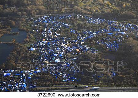 Stock Image - France, Pas de Calais, Calais. Aerial view of the jungle. Migrants camp... Fotosearch