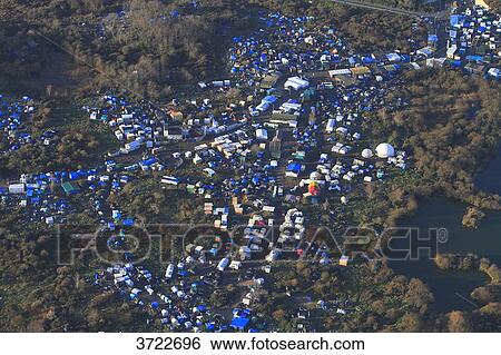 France, Pas de Calais, Calais. Aerial view of the jungle. Migrants camp.. View Large Photo Image Stock Photograph - France, Pas de Calais, Calais. Aerial view of the jungle. Migrants camp... Fotosearch