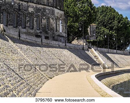 Stock Image - France, Provence Alpes Cote d'Azur, Bouches du Rhone, Arles, the restored wharf of the Rhone near the Reattu museum. Fotosearch