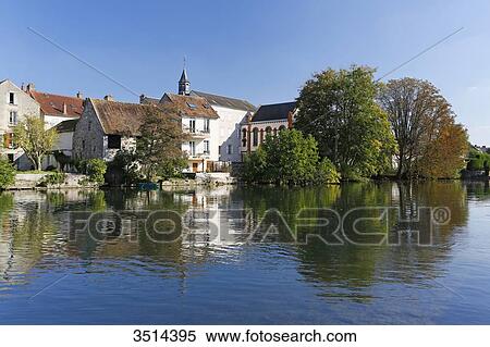 France, Seine and Marne. Nemours. City center. The Loing river in the foreground. View Large Photo Image Stock Photography - France, Seine and Marne. Nemours. City center. The Loing river in the foreground.. Fotosearch