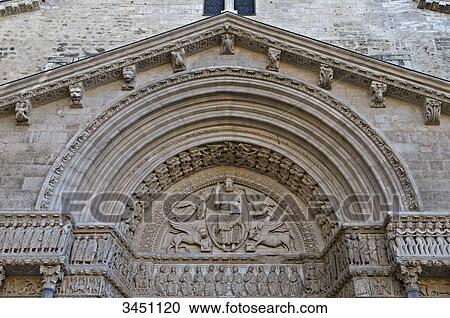 France, South-Eastern France, Arles, Church of Saint Trophime, sculpted Romanesque portal, the Christ and the four Evangelists, tracery representing a Tetramorph, apostles on the fresco of the entablature View Large Photo Image Stock Image - France, South-Eastern France, Arles, Church of Saint Trophime, sculpted Romanesque portal, the Christ and the four Evangelists, tracery representing a Tetramorph, apostles on the fresco of the entablature. Fotosearch