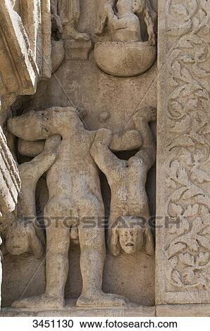 Stock Image - France, South-Eastern France, Arles, Church of Saint Trophime, sculpted Romanesque southern portal. Fotosearch