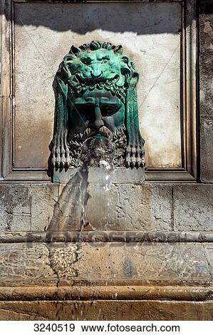 France, South-Eastern France, Arles, bronze head of a man on the fountain on the Place de la Rpublique View Large Photo Image Stock Photo - France, South-Eastern France, Arles, bronze head of a man on the fountain on the Place de la Rpublique. Fotosearch