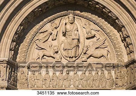 Stock Photography - France, South-Eastern France, Arles, Church of Saint Trophime, sculpted Romanesque southern portal, the Christ and the four Evangelists, tracery representing a Tetramorph, apostles on the fresco of the entablature. Fotosearch