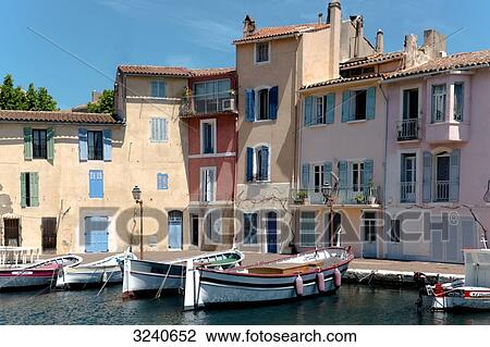 Stock Image - France, south-eastern France, Martigues, rowboats berthed along the wharf. Fotosearch