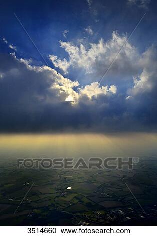 France, Western France, aerial and vertical view of the Vendee countryside. Imposing cloud and play of light against the light View Large Photo Image Stock Image - France, Western France, aerial and vertical view of the Vendee countryside. Imposing cloud and play of light against the light. Fotosearch